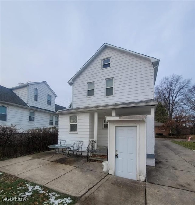 back of house with a patio