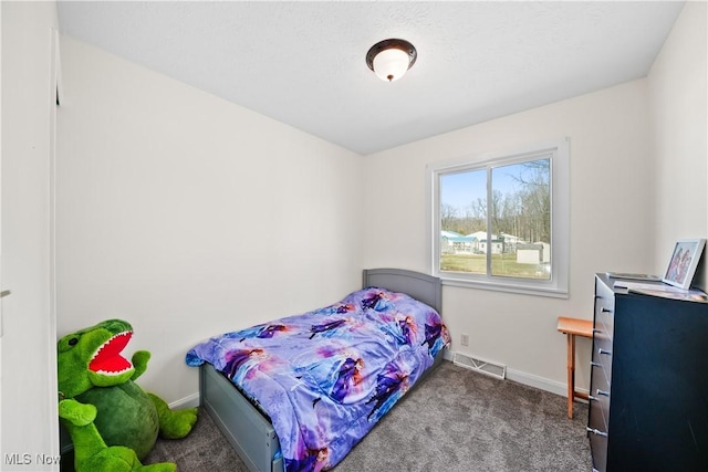 carpeted bedroom featuring baseboards and visible vents