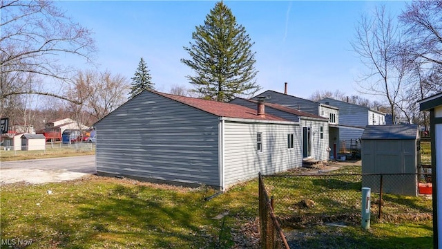 view of shed with fence