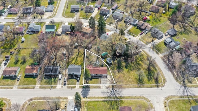 birds eye view of property with a residential view