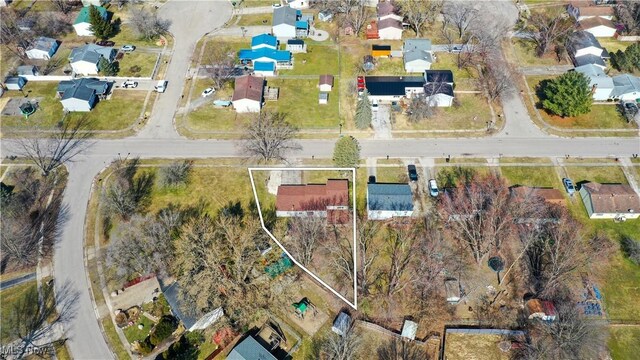 birds eye view of property with a residential view