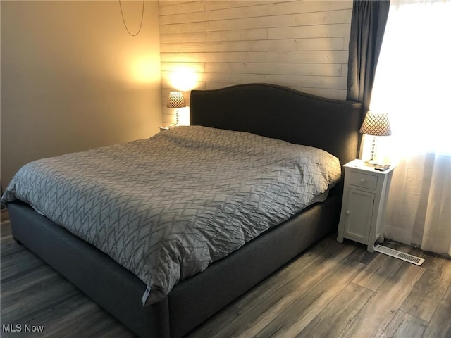 bedroom with wood finished floors