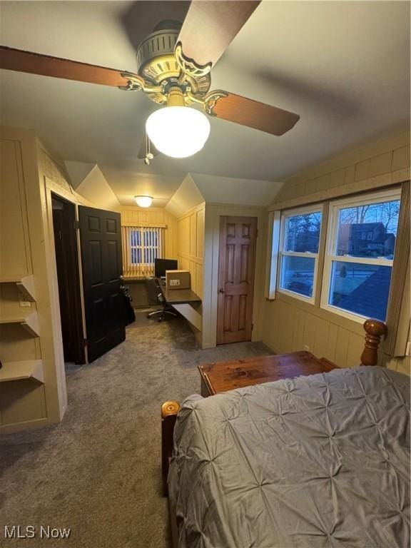 bedroom featuring dark colored carpet, ceiling fan, and vaulted ceiling