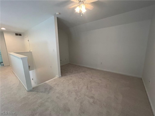 bonus room featuring visible vents, baseboards, carpet, and a ceiling fan