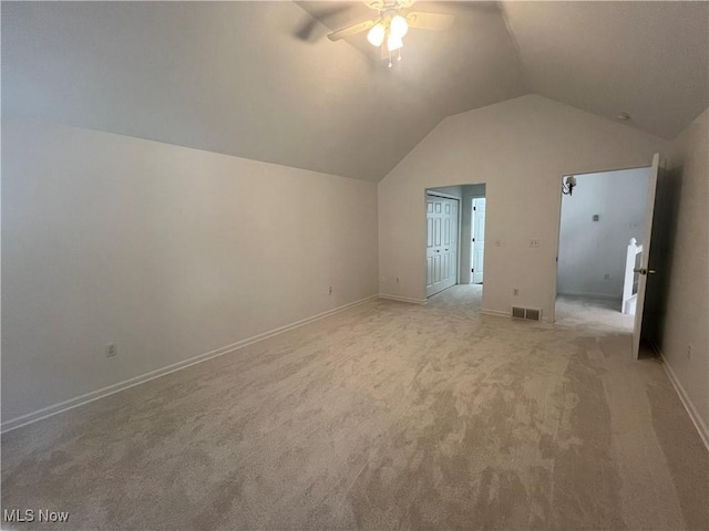 bonus room with visible vents, baseboards, lofted ceiling, light colored carpet, and ceiling fan