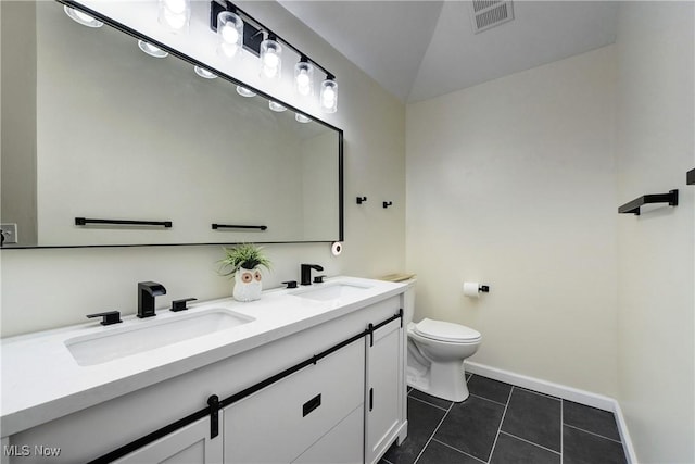 full bath with tile patterned floors, toilet, visible vents, and a sink