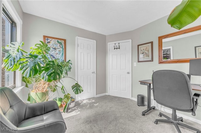 home office featuring baseboards and carpet