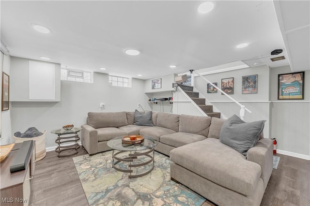 living area with stairway, recessed lighting, and wood finished floors