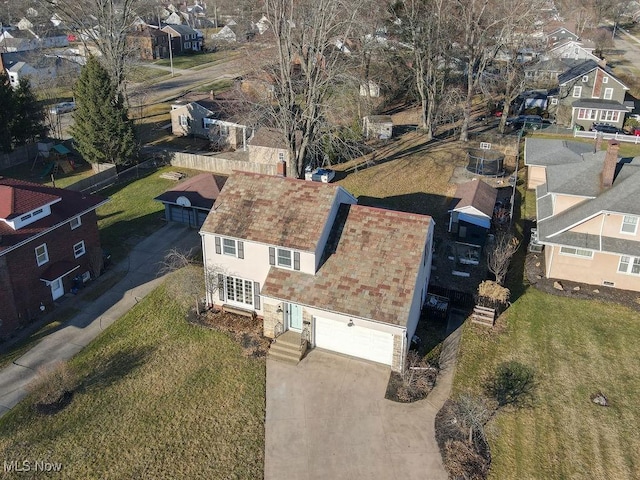 birds eye view of property with a residential view