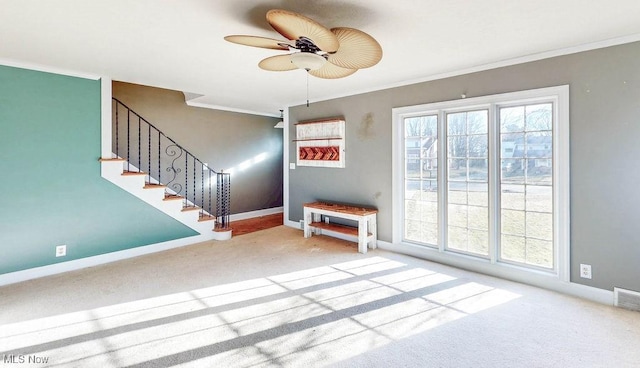 interior space with crown molding, stairway, baseboards, and a wealth of natural light