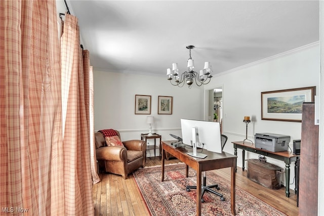 office area with crown molding, hardwood / wood-style flooring, and a chandelier