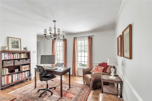 home office featuring light wood-type flooring, baseboards, a chandelier, and ornamental molding