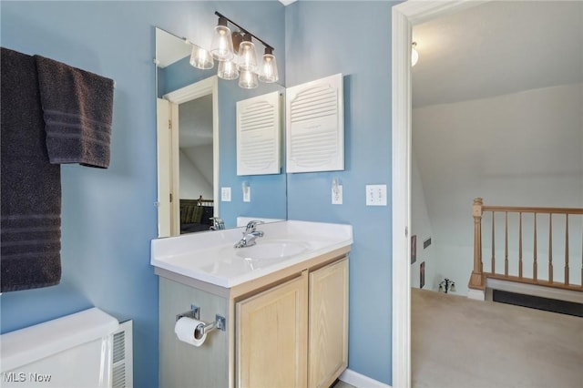 bathroom with vanity and visible vents