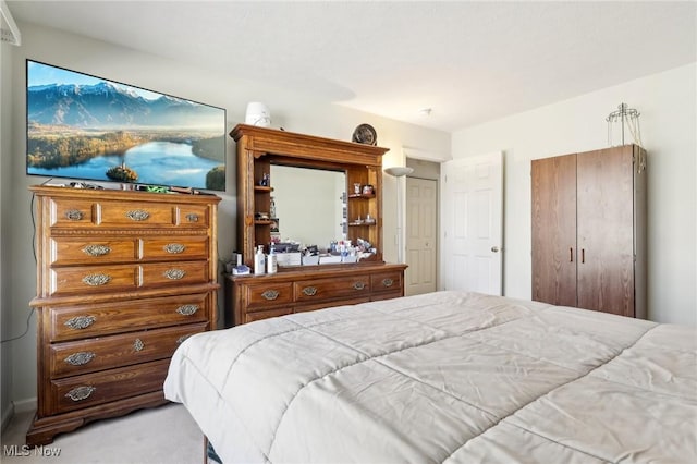 bedroom with light colored carpet