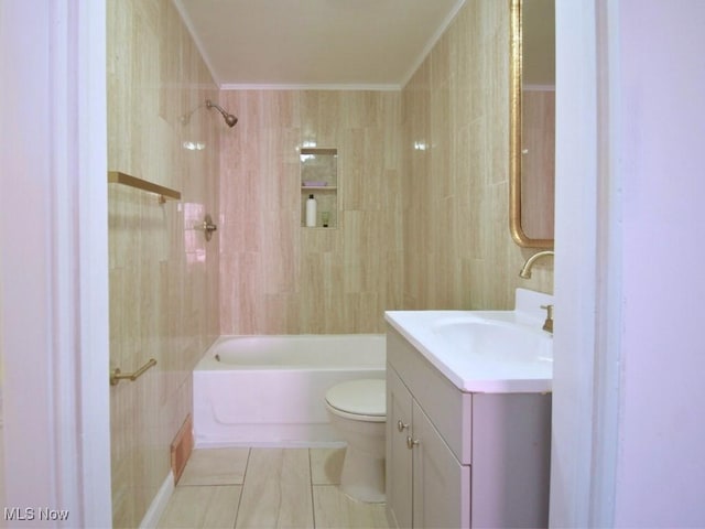 full bath with tile patterned flooring, crown molding, toilet, shower / bath combination, and vanity