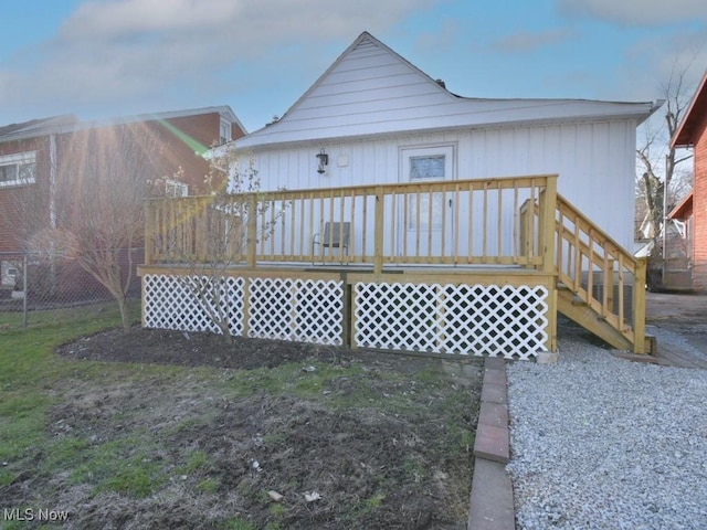 rear view of house featuring a deck