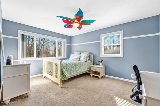 bedroom with baseboards, carpet, and ceiling fan