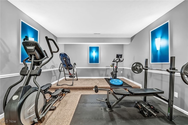 workout room with visible vents, baseboards, and carpet