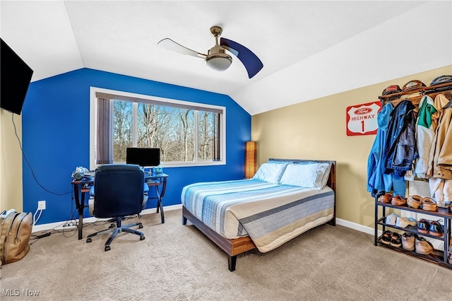 bedroom featuring baseboards, a ceiling fan, lofted ceiling, and carpet floors