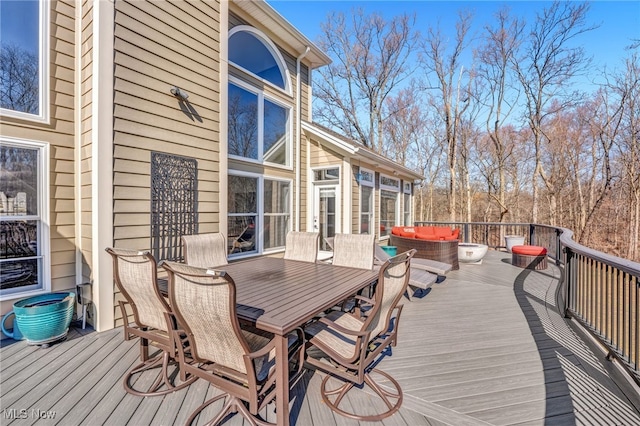 wooden deck with outdoor lounge area and outdoor dining area