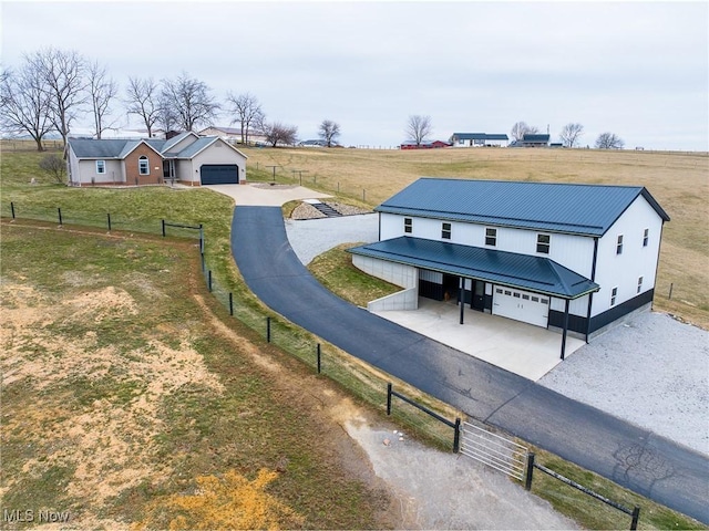 birds eye view of property featuring a rural view