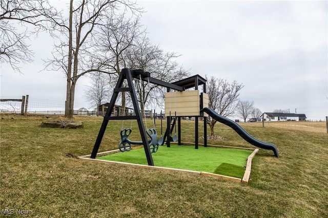 community playground with a lawn and fence