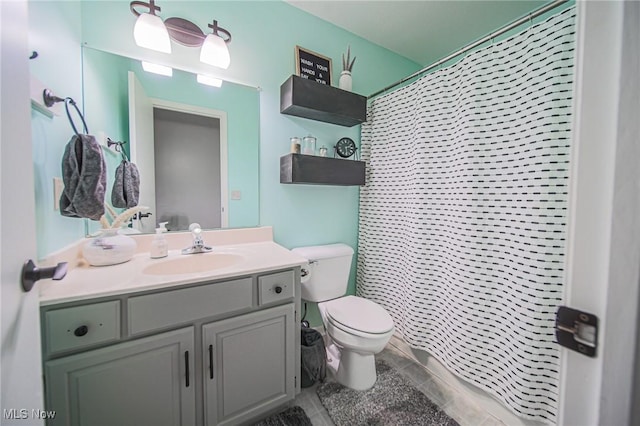 bathroom featuring curtained shower, toilet, and vanity