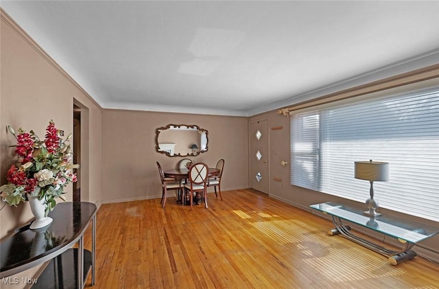 interior space with light wood finished floors and baseboards