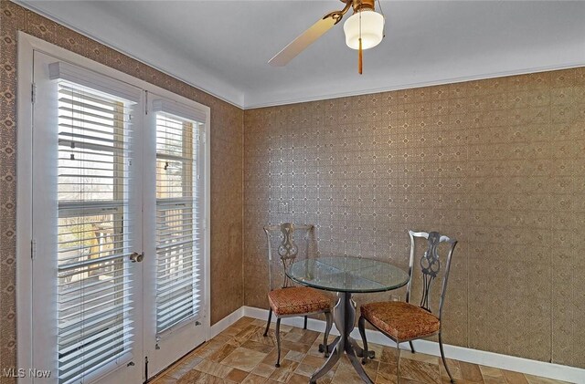 dining room with baseboards and ceiling fan