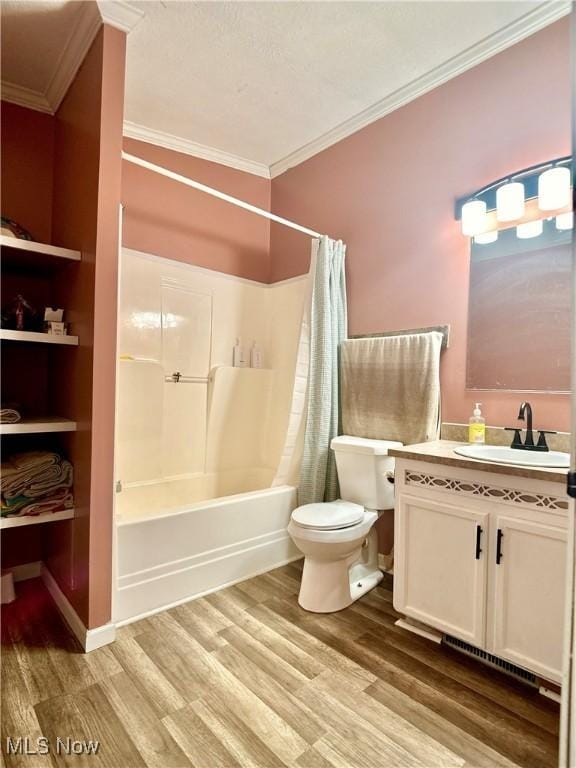 bathroom with toilet, wood finished floors, shower / tub combo with curtain, and ornamental molding