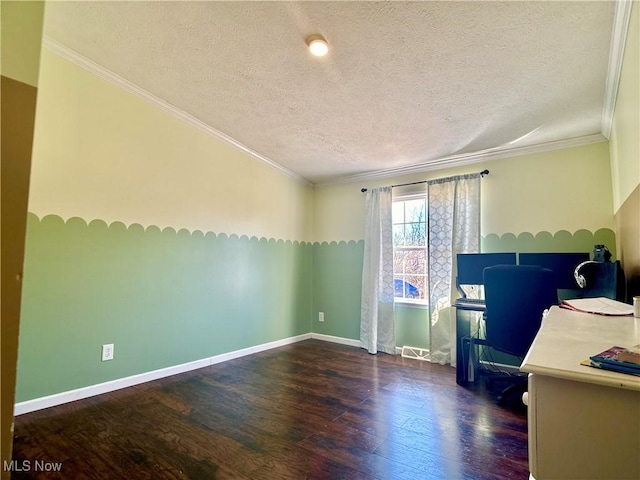 interior space with baseboards, a textured ceiling, wood finished floors, and crown molding