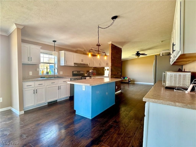 kitchen featuring a sink, stainless steel range with electric cooktop, dark wood-type flooring, light countertops, and under cabinet range hood