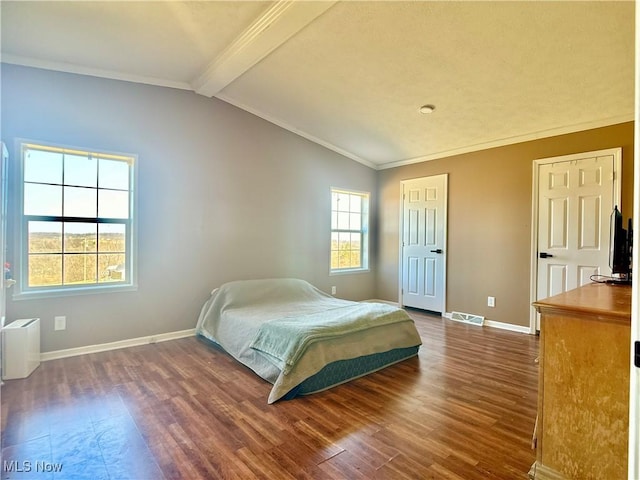 bedroom with dark wood finished floors, lofted ceiling with beams, and baseboards