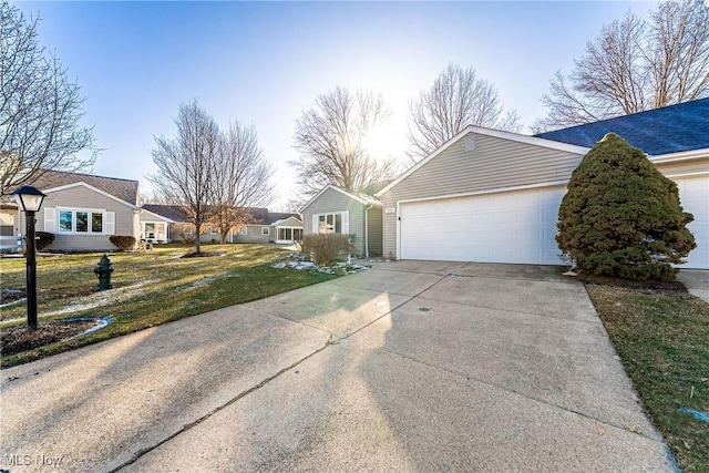 view of property exterior with a yard and a garage