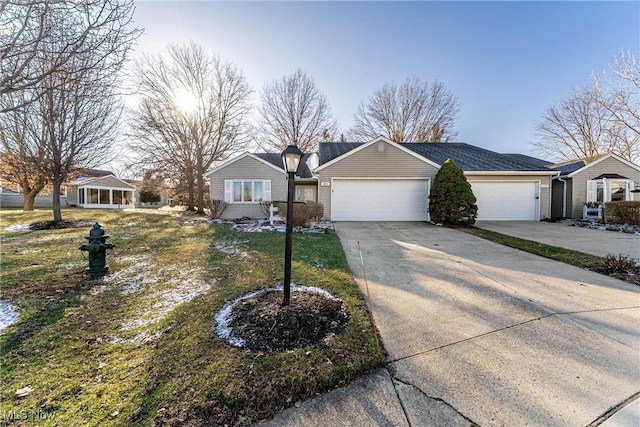 ranch-style house with an attached garage and driveway