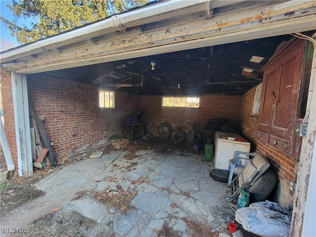 exterior space with brick wall and a wood stove