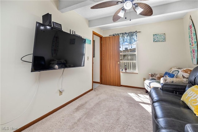 carpeted living room with beam ceiling, a ceiling fan, and baseboards