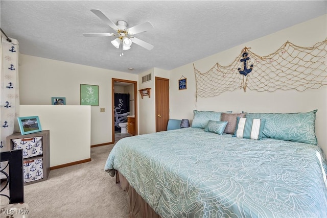 bedroom featuring baseboards, visible vents, carpet floors, and a textured ceiling