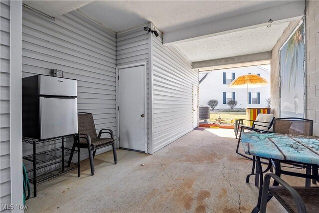 view of patio with central AC