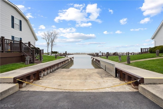 exterior space featuring a yard and a water view