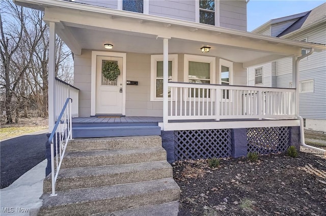 entrance to property with covered porch