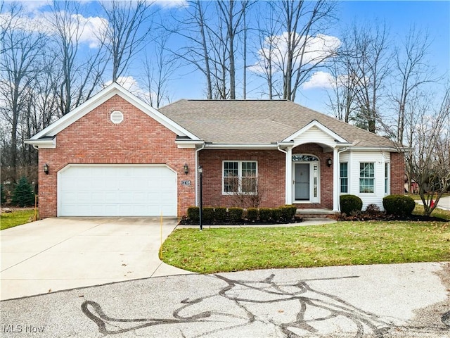 single story home with brick siding, an attached garage, a shingled roof, a front lawn, and driveway