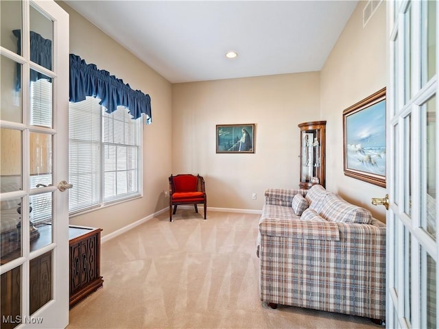 living area featuring recessed lighting, french doors, baseboards, and carpet floors