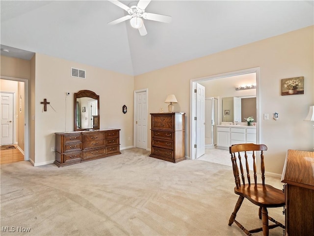 bedroom featuring baseboards, light colored carpet, visible vents, and high vaulted ceiling