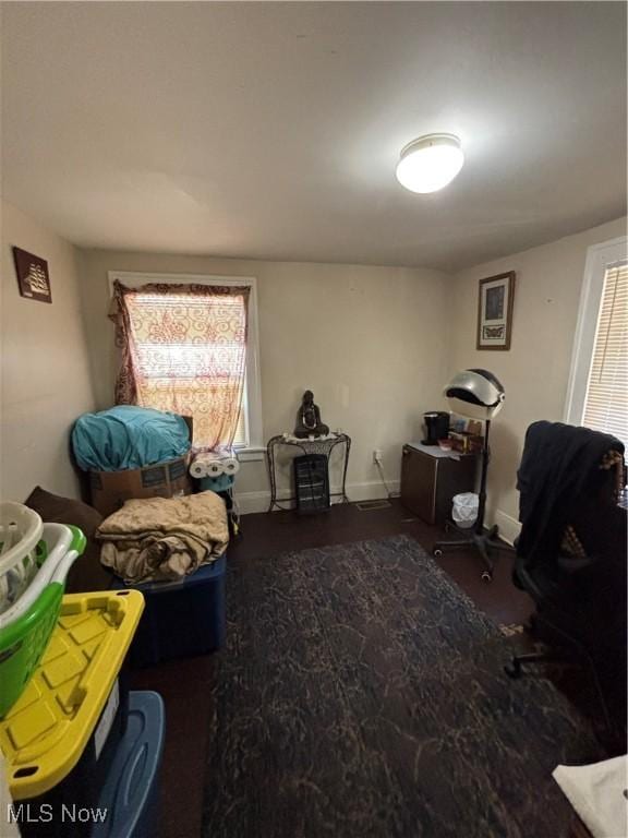 interior space with dark wood finished floors and baseboards