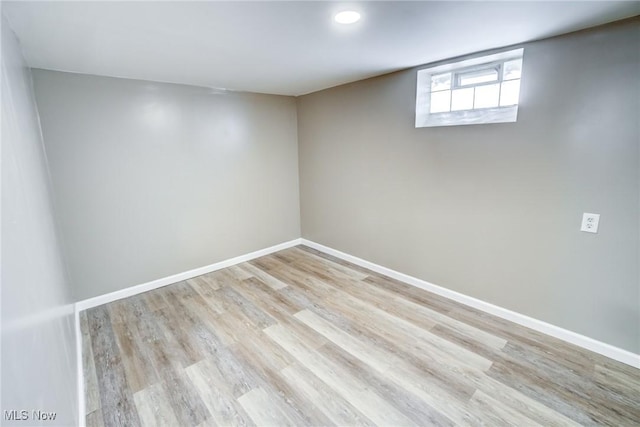 basement with wood finished floors and baseboards