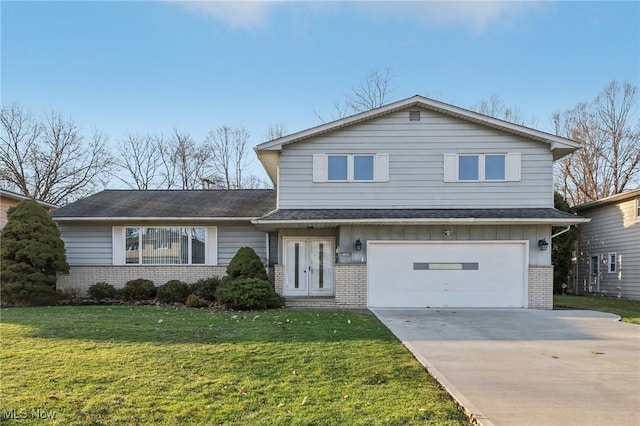 traditional-style home with brick siding, an attached garage, board and batten siding, a front lawn, and driveway