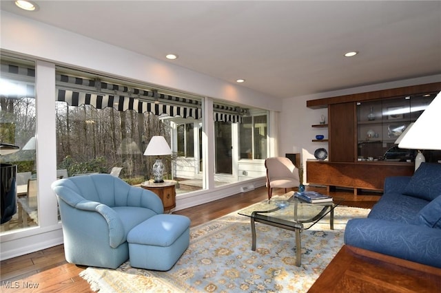 living room featuring recessed lighting and wood finished floors