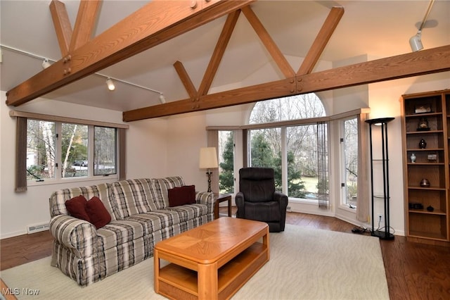 living room with visible vents, beam ceiling, wood finished floors, and track lighting