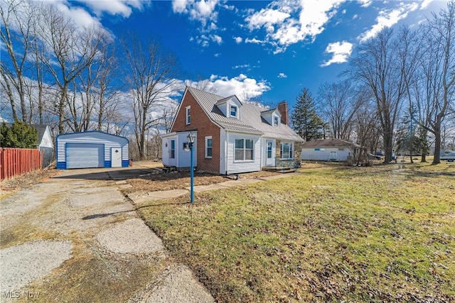 view of property exterior featuring a detached garage, fence, a chimney, an outbuilding, and driveway